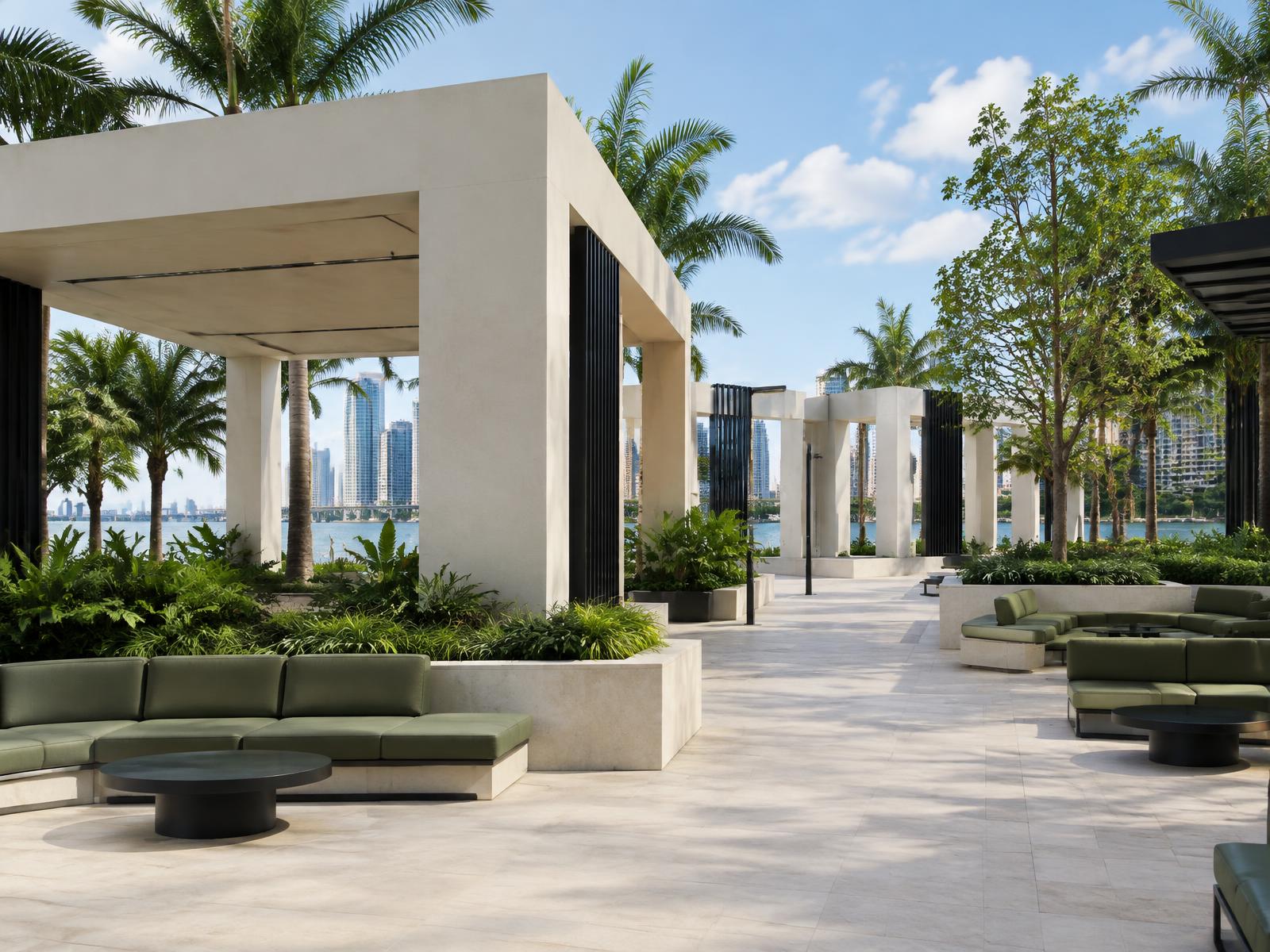 Open-air civic gathering environment with ivory architecture and olive seating